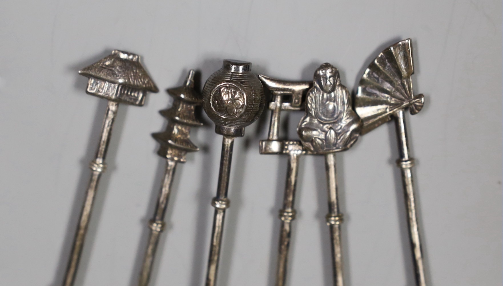 A set of six Japanese sterling iced teaspoons, 19.5cm, with differing terminals, 48 grams.